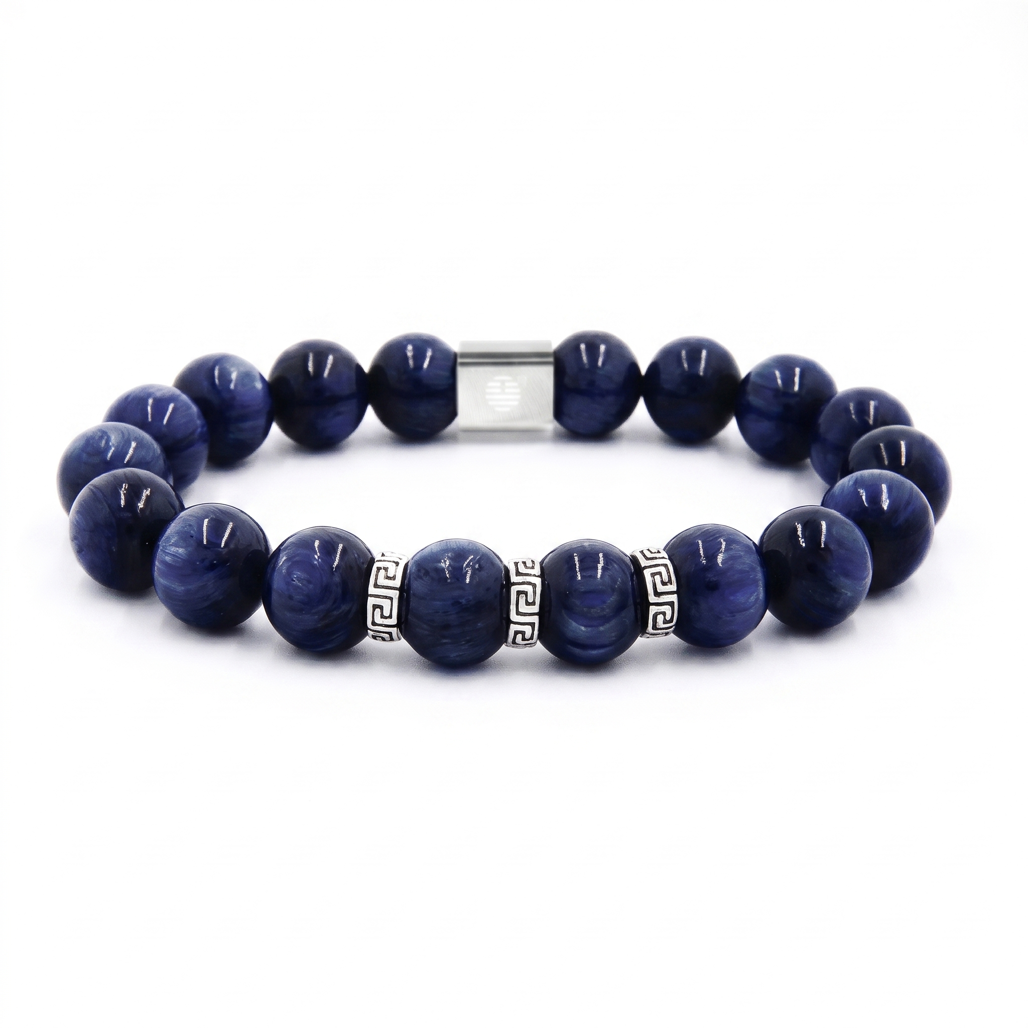 A beaded bracelet made of dark blue polished round beads with a silver-toned metal clasp and small silver geometric spacer beads, shown on a plain white background.