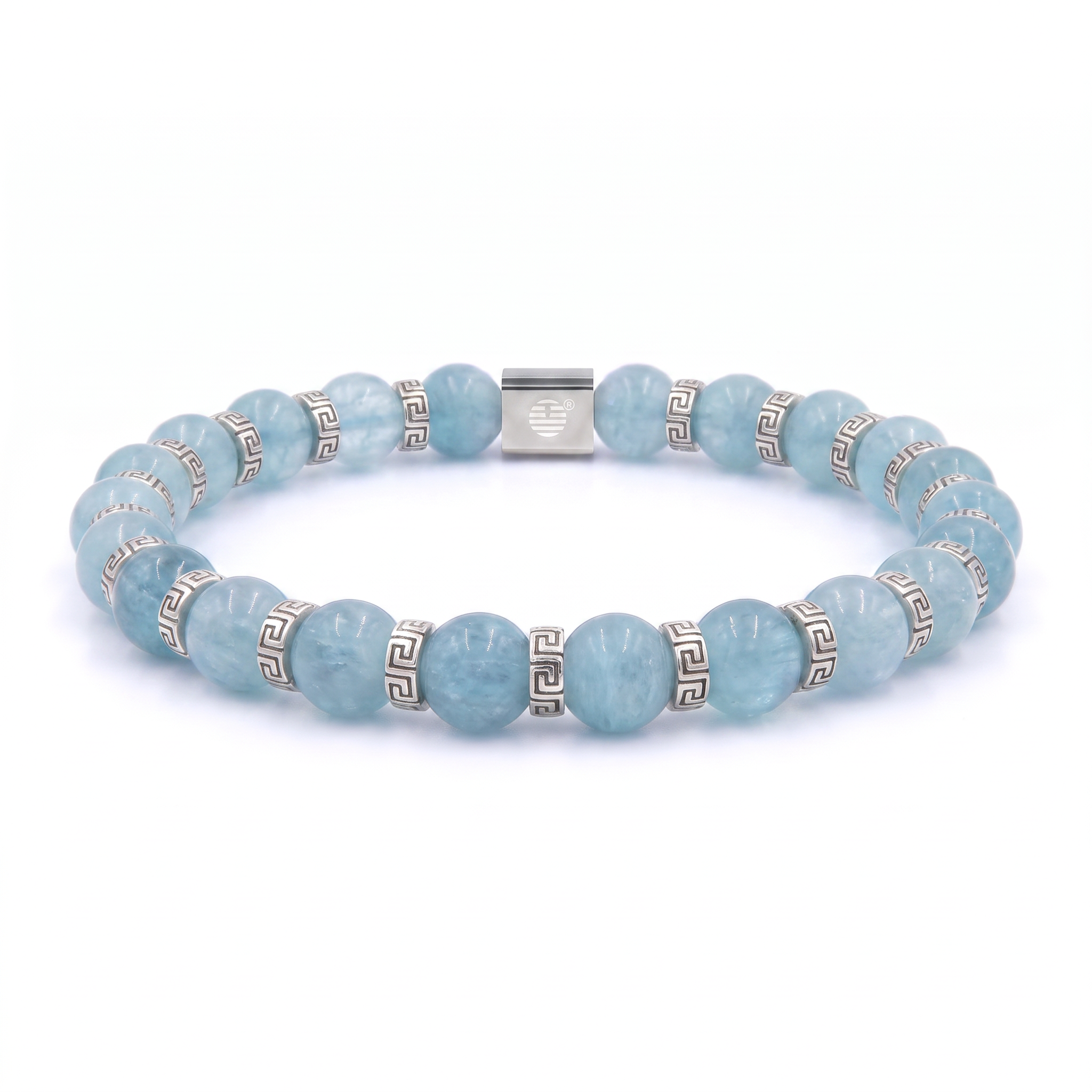 A beaded stretch bracelet made of light blue round gemstone beads and silver-toned spacer beads with a Greek key pattern, featuring a central silver clasp engraved with a heart, shown on a white background.