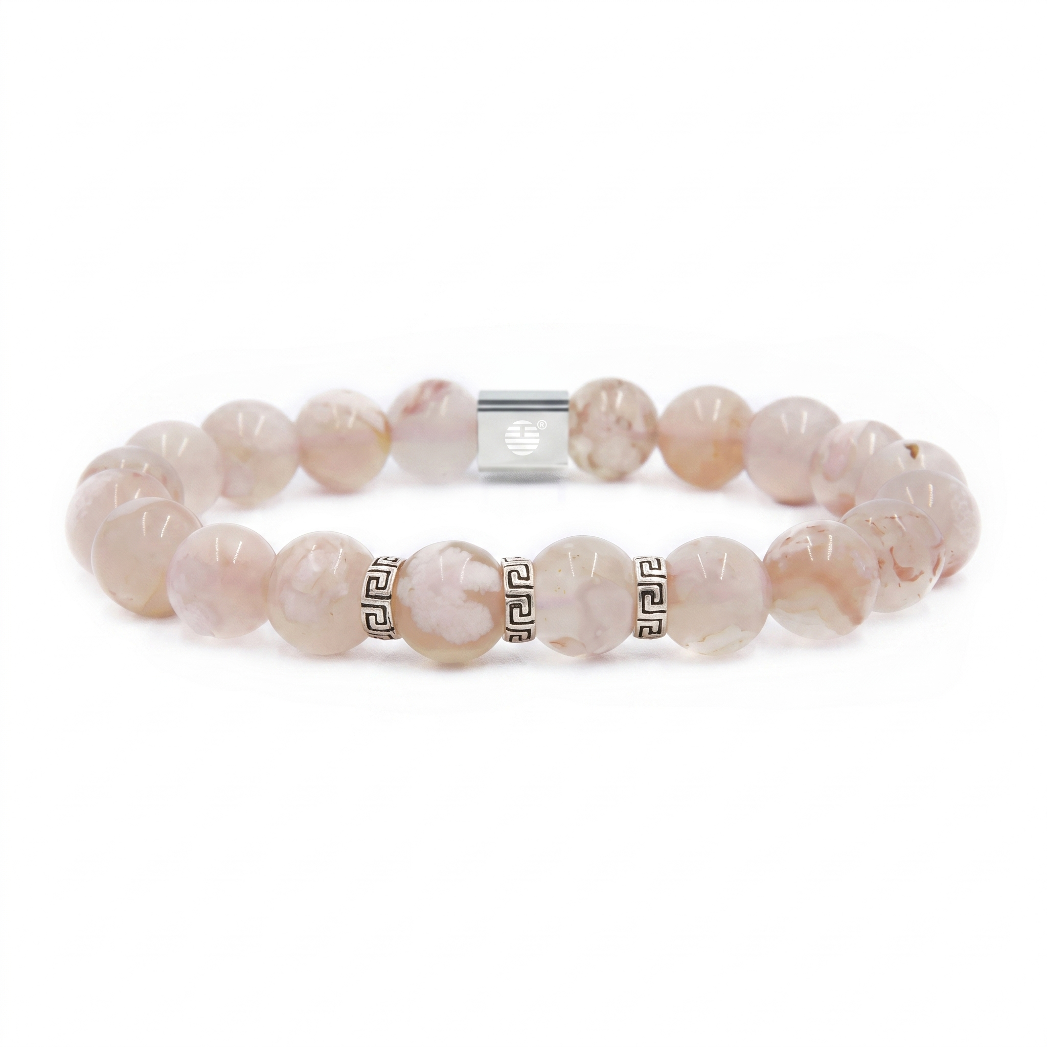 A beaded stretch bracelet made of pale pink and white marbled round beads, accented with silver-tone Greek key spacer beads and a silver magnetic clasp, shown on a plain white background.