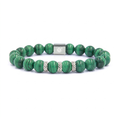 A green malachite bead bracelet with silver-tone accents, including a central square spacer and two cylindrical Greek key spacer beads, shown on a plain white background.