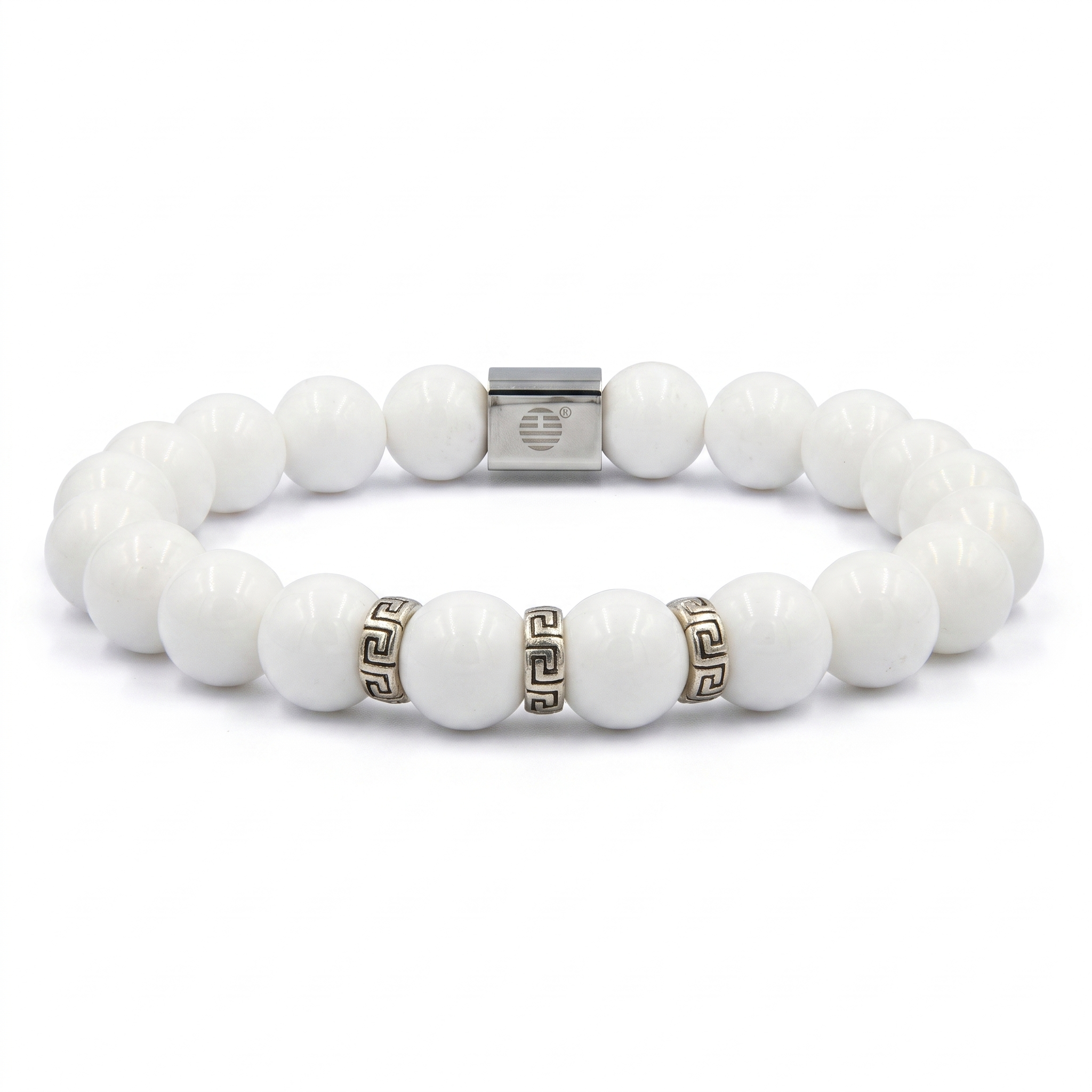 A white beaded stretch bracelet with a silver-toned square clasp and two small Greek key pattern spacer beads, shown on a plain white background.