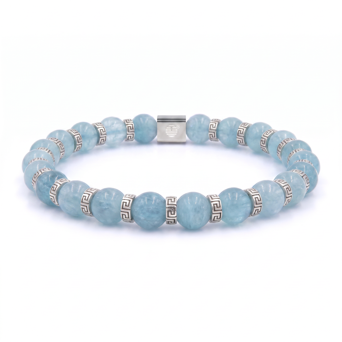 A beaded stretch bracelet made of light blue round gemstone beads and silver-toned spacer beads with a Greek key pattern, featuring a central silver clasp engraved with a heart, shown on a white background.