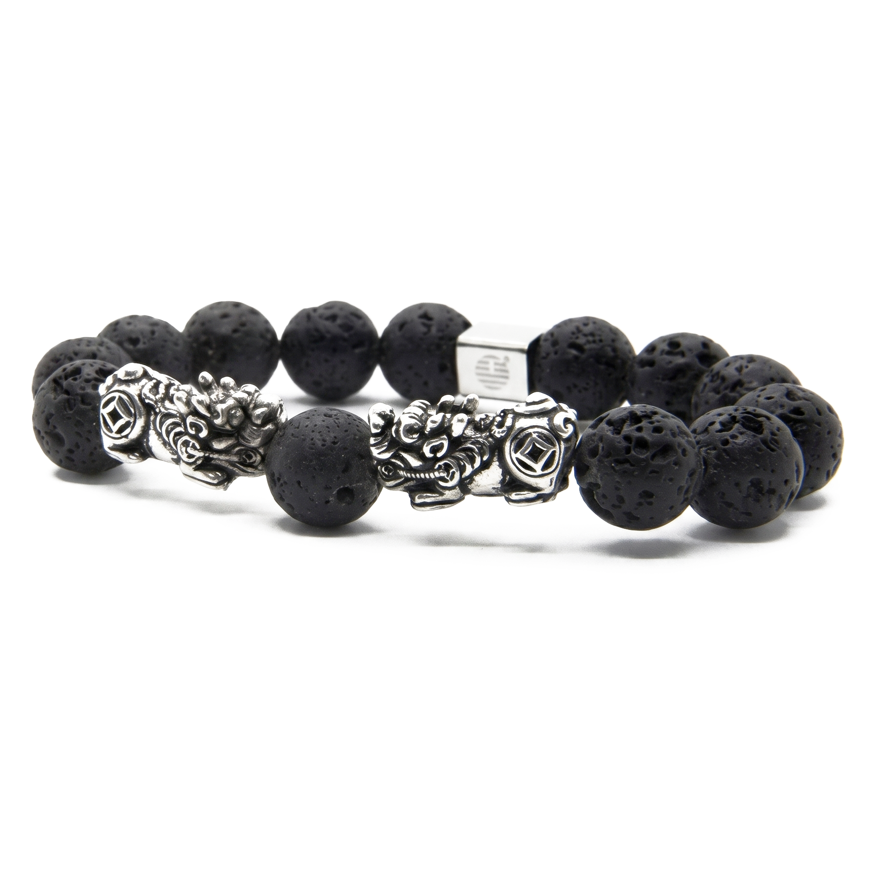 A beaded stretch bracelet featuring matte black lava stone beads and two silver-toned metal dragon charms, displayed on a clean white background.