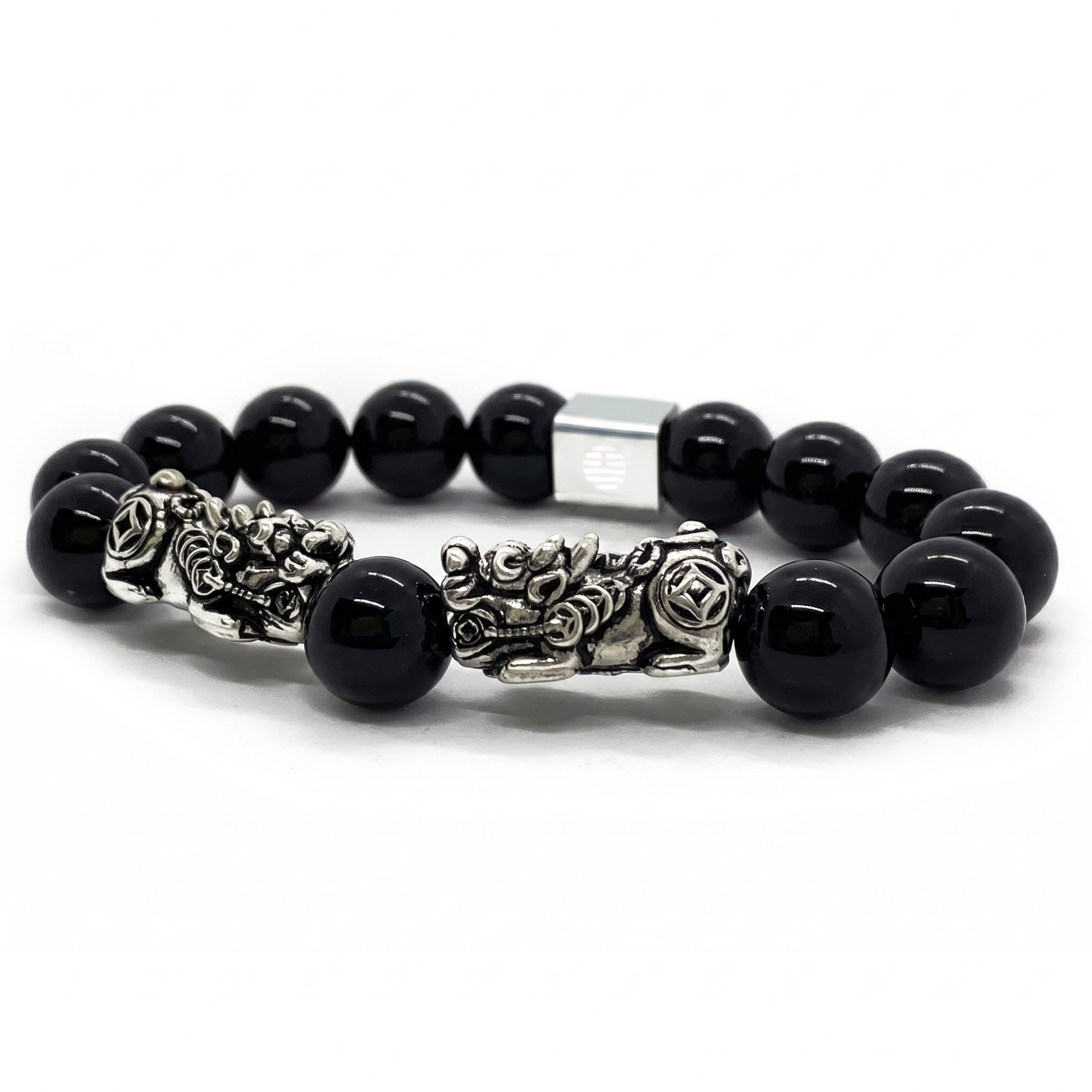 A beaded bracelet featuring glossy black round beads and ornate silver-toned metal charms, including a central lion and rose detail, set against a plain white background.