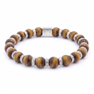 A beaded stretch bracelet made of brown tiger's eye beads and silver-tone spacer rings with Greek key motifs and a central clasp, shown on a plain white background.